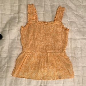 Orange flowy top, mesh material